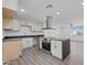 Modern kitchen with island, stainless steel appliances, and dark countertops at 632 N 72Nd Pl, Scottsdale, AZ 85257