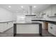 Modern kitchen with a large island and dark countertops at 632 N 72Nd Pl, Scottsdale, AZ 85257