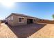 Backyard of a single-story home with a covered patio and a dirt ground at 16348 W Avenida Del Sol --, Surprise, AZ 85387