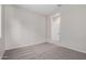 View of a spare bedroom with carpeting and neutral-colored walls at 16348 W Avenida Del Sol --, Surprise, AZ 85387