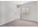 Unfurnished bedroom with neutral carpet, white walls, and a window at 16348 W Avenida Del Sol --, Surprise, AZ 85387