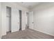 Unfurnished bedroom featuring plush carpeting and a closet with sliding doors at 16348 W Avenida Del Sol --, Surprise, AZ 85387