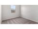 Unfurnished bedroom with neutral-colored carpeting and a single window at 16348 W Avenida Del Sol --, Surprise, AZ 85387