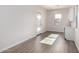 Casita space with wood-style flooring, a small kitchen area, and a door at 16348 W Avenida Del Sol --, Surprise, AZ 85387