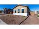 Exterior view of a house with desert landscaping and a walkway at 16348 W Avenida Del Sol --, Surprise, AZ 85387