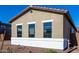 Side exterior of a single-story home with several large windows at 16348 W Avenida Del Sol --, Surprise, AZ 85387