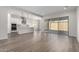 Open living area with sliding glass doors and view of the kitchen at 16348 W Avenida Del Sol --, Surprise, AZ 85387