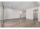 Spacious main bedroom with wood-look flooring and sliding glass door at 16348 W Avenida Del Sol --, Surprise, AZ 85387