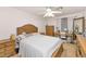 Bright bedroom with a queen-size bed, dresser, and a vanity area at 9558 W Gambit Trl, Peoria, AZ 85383
