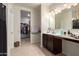 Bathroom with double vanity, walk-in shower, and large mirror at 285 S Espada Trl, Casa Grande, AZ 85194