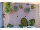 Landscaped backyard with gravel, shrubs, and flowering plants at 285 S Espada Trl, Casa Grande, AZ 85194