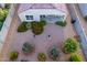 Aerial view of a backyard with gravel, landscaping, and a patio at 285 S Espada Trl, Casa Grande, AZ 85194