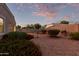 Landscaped backyard with gravel, bushes, and a grill at 285 S Espada Trl, Casa Grande, AZ 85194