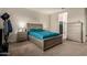 Relaxing bedroom with a king-size bed and ensuite bathroom access at 285 S Espada Trl, Casa Grande, AZ 85194
