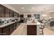 Open kitchen with large island and granite countertops at 285 S Espada Trl, Casa Grande, AZ 85194