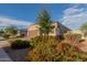 One-story home with brown garage door and landscaping at 285 S Espada Trl, Casa Grande, AZ 85194