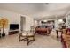 Spacious living room featuring a comfortable sofa and a large flat-screen TV at 285 S Espada Trl, Casa Grande, AZ 85194