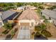Aerial view of a one-story house with a tiled roof, driveway, and landscaping at 285 S Espada Trl, Casa Grande, AZ 85194
