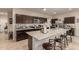Modern kitchen with granite island and stainless steel appliances at 285 S Espada Trl, Casa Grande, AZ 85194