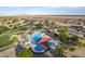 Aerial view of a community pool with a waterslide and park at 285 S Espada Trl, Casa Grande, AZ 85194