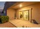 Covered patio with sliding glass doors leading to the interior of the house at 285 S Espada Trl, Casa Grande, AZ 85194