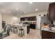 Well-equipped kitchen boasting dark cabinetry and granite countertops at 285 S Espada Trl, Casa Grande, AZ 85194