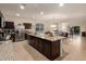 Open-concept kitchen with island and stainless steel appliances at 285 S Espada Trl, Casa Grande, AZ 85194