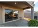Covered patio with sliding glass doors and view of backyard at 285 S Espada Trl, Casa Grande, AZ 85194