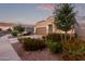 One-story home with brown garage door and landscaping at 285 S Espada Trl, Casa Grande, AZ 85194
