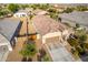 Aerial view of a single-story house with a two-car garage and desert landscaping at 285 S Espada Trl, Casa Grande, AZ 85194