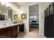 Main bathroom with double vanity and view of bedroom at 285 S Espada Trl, Casa Grande, AZ 85194