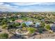 Aerial view of a community pool with a waterslide and surrounding park area at 285 S Espada Trl, Casa Grande, AZ 85194