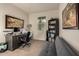 Home office with desk, chair, bookcase, and comfortable sofa at 285 S Espada Trl, Casa Grande, AZ 85194