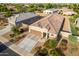 Aerial view of a single-story house with a two-car garage and landscaped yard at 285 S Espada Trl, Casa Grande, AZ 85194