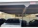 Carport with space for two cars and a trash bin at 605 N Lesueur Cir, Mesa, AZ 85203