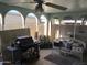 Covered patio with seating area, grill and plants at 605 N Lesueur Cir, Mesa, AZ 85203