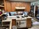 View of kitchen with stove, oven and lots of cabinets at 605 N Lesueur Cir, Mesa, AZ 85203