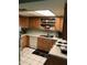 Kitchen boasts ample counter space and wood cabinets at 605 N Lesueur Cir, Mesa, AZ 85203