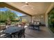 Outdoor patio with seating area and a view of the backyard at 18009 E Silver Sage Ln, Rio Verde, AZ 85263