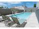 Community pool with lounge chairs and patio area at 535 W Thomas Rd # 503, Phoenix, AZ 85013