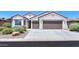 Two-car garage and front yard landscaping at 5074 N Scottsdale Rd, Eloy, AZ 85131