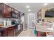 Kitchen with granite countertops and dark brown cabinets at 8690 S 253Rd Ave, Buckeye, AZ 85326