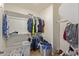 Large walk-in closet with ample shelving and hanging space at 8690 S 253Rd Ave, Buckeye, AZ 85326