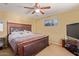 Spacious bedroom with a king-size bed and built in shelving at 8690 S 253Rd Ave, Buckeye, AZ 85326