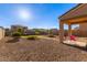 Landscaped backyard with gravel and artificial turf at 8690 S 253Rd Ave, Buckeye, AZ 85326