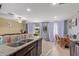 Kitchen with granite countertops, dark brown cabinets, and stainless steel appliances at 8690 S 253Rd Ave, Buckeye, AZ 85326