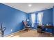 Bright bedroom with a desk and gaming chair at 8690 S 253Rd Ave, Buckeye, AZ 85326
