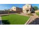 Artificial turf backyard with covered patio at 8690 S 253Rd Ave, Buckeye, AZ 85326