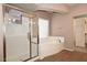 Spa-like bathroom with soaking tub and separate shower at 27762 N 96Th Dr, Peoria, AZ 85383