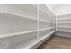 Large pantry with ample shelving for storage at 23392 S 209Th Pl, Queen Creek, AZ 85142